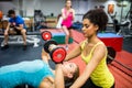 Fit people working out in weights room Royalty Free Stock Photo