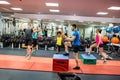 Fit people working out in weights room Royalty Free Stock Photo