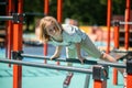 Young gymnast doing a bodyweight exercise outdoors