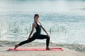 Fit pretty female practice yoga exercise outdoors Royalty Free Stock Photo