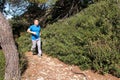 Fit runner man jogging for fitness running at running trail in beautiful landscape nature outdoors. Royalty Free Stock Photo