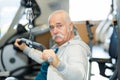 Fit senior man working out at gym club