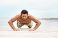 Fit shirtless male fitness model in push up exercise Royalty Free Stock Photo