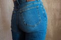 Fit slim female in blue jeans. Woman buttocks in denim. Royalty Free Stock Photo