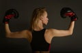 Fit slim young beautiful blonde woman boxing in sportswear