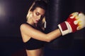 Fit slim young beautiful brunette woman boxing in sportswear. Da Royalty Free Stock Photo