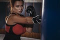 Fit slim young beautiful brunette woman boxing in sportswear. Da Royalty Free Stock Photo