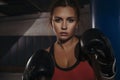 Fit slim young beautiful brunette woman boxing in sportswear. Da Royalty Free Stock Photo