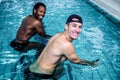 Fit smiling men doing swimming bike Royalty Free Stock Photo