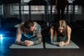 Fit sportive man and woman doing plank core exercise training back and press muscles concept gym sport sportsman fitness Royalty Free Stock Photo