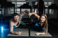 Fit sportive man and woman doing plank core exercise training back and press muscles concept gym sport sportsman fitness Royalty Free Stock Photo