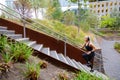 Fit sports women running interval workout in stairs in city park