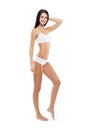 Fit and sporty girl in white swimsuit. Sport, fitness, diet, weight loss and healthcare concept.