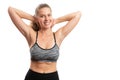 Fit sporty woman showing abdomen smiling with blank copyspace