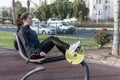 Girl exercising on a sport bicycle machine in outdoor gym Royalty Free Stock Photo