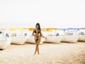 Fit and sporty woman in a swimsuit relaxing on a beach at summer Royalty Free Stock Photo