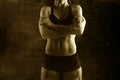 Fit and strong sport woman holding posing defiant in cool attitude with welt built body