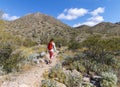 Woman With Backpack On A Desert Hiking Trail In Arizona