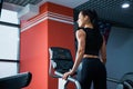 Fit woman on cardio stepper machine at gym Royalty Free Stock Photo