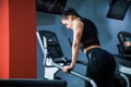 Fit woman on cardio stepper machine at gym Royalty Free Stock Photo