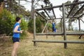 Fit woman climbing monkey bars Royalty Free Stock Photo