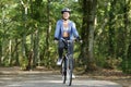 fit woman cycling in forest Royalty Free Stock Photo