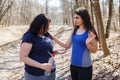 Fit woman dissuade her overweight friend from taking slimming pi Royalty Free Stock Photo