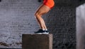 Fit woman doing box jump exercise. Muscular woman doing box jumps at gym Royalty Free Stock Photo