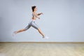 Fit woman doing cardio interval training in gym. Woman in sportswear is running and jumping. Fitness and sport concept Royalty Free Stock Photo