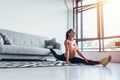 Fit woman doing split exercising at home Flexibility, stretching, fitness Royalty Free Stock Photo