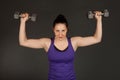 Fit woman doing weight training Royalty Free Stock Photo