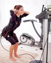 Fit woman exercise on electro muscular woman