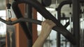 Fit woman exercising with a lat pulldown machine