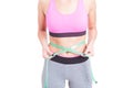 Fit woman holding tape line on waist Royalty Free Stock Photo