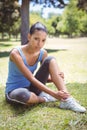 Fit woman with injured ankle Royalty Free Stock Photo