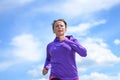 Fit woman jogging along a rural lane