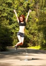 Fit woman jumping in air Royalty Free Stock Photo