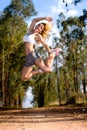 Fit woman jumping high