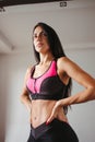 Fit woman with perfect muscular body in activewear