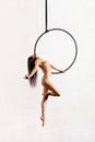 Fit woman performing pose on aerial hoop Royalty Free Stock Photo