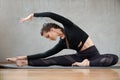 Fit woman practicing yoga side bending exrcise. Royalty Free Stock Photo