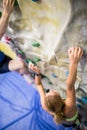 Fit woman rock climbing indoors Royalty Free Stock Photo