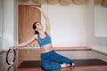 Fit woman in sportswear exercising with a pilates ring in the gym. Copy space Royalty Free Stock Photo