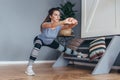 Fit woman stretching legs Lateral Lunge exercise.