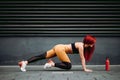 fit woman stretching and working out, doing plank exercises Royalty Free Stock Photo