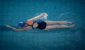 Fit woman swimming in the pool