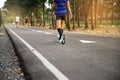 Fit woman walking in park during autumn time Royalty Free Stock Photo