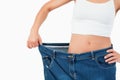 Fit woman wearing too large jeans Royalty Free Stock Photo