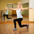 Fit woman work out in gym making lunge step Royalty Free Stock Photo