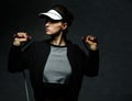 Fit woman workout with resistance band against dark background Royalty Free Stock Photo